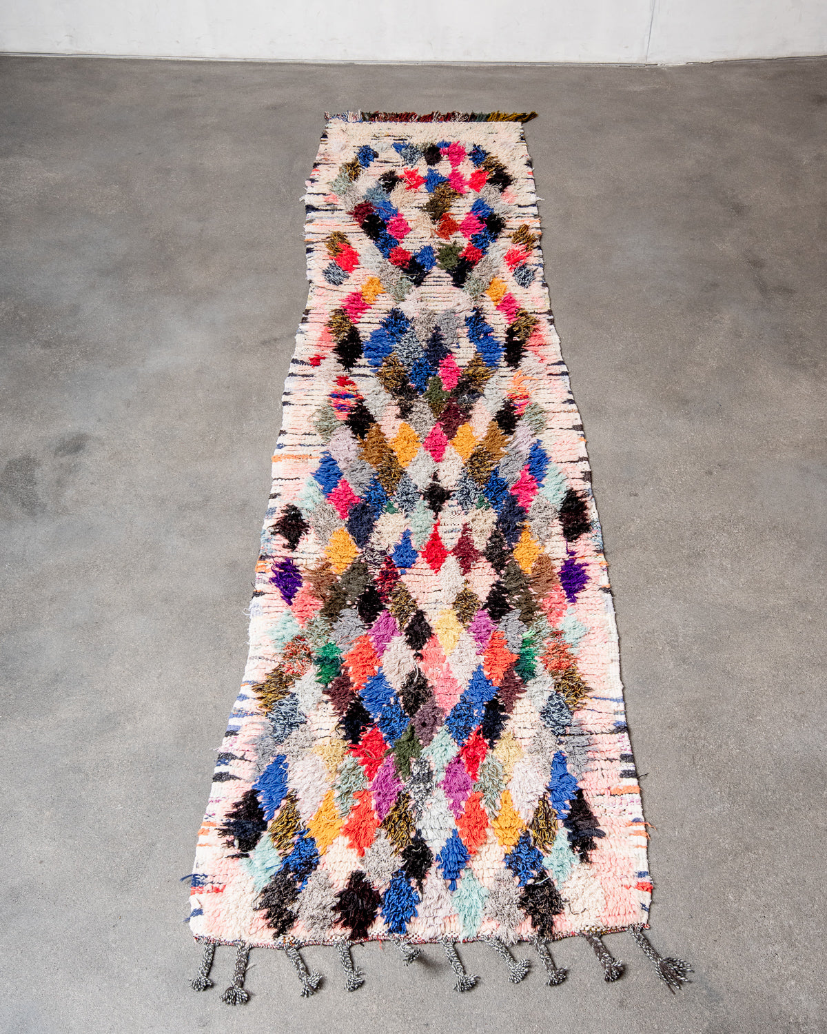 Modern designer vintage handcrafted Berber rug from Morocco. Boucherouite runner rug with beautiful colors and patterns.